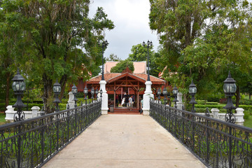 Kanchanaburi, Thailand, 09.09.2019: Beautiful garden, lake, traditional Thai, Siamese clothes, buildings of 