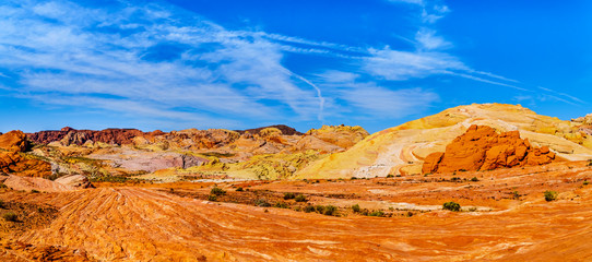 Fototapeta na wymiar The colorful red, yellow and white banded rock formations along the Fire Wave Trail in the Valley of Fire State Park in Nevada, USA