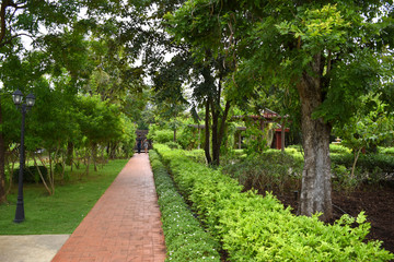 Kanchanaburi, Thailand, 09.09.2019: Beautiful garden, lake, traditional Thai, Siamese clothes, buildings of 