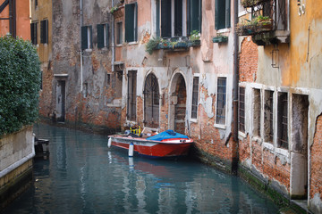 Fototapeta na wymiar Beautiful canals of Venice with old buildings and boats. Venice, Italy.