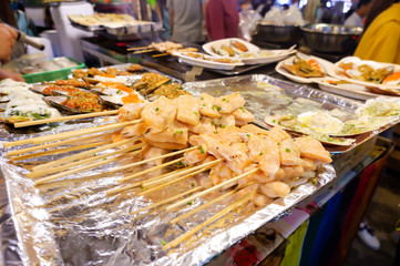Salmon with sticks , Street food in Thailand