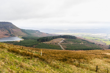 View over Welsh countryside, the Vale of Neath with reservoir or dam.