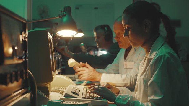 Vintage sci-fi scientists working in a operation room