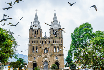 Fototapeta premium View on church and main square in colonial city El Jardin, Colombia, South America
