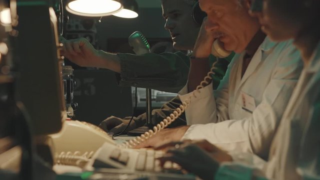 Vintage sci-fi scientists working in a operation room
