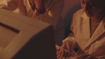 Operators working in the control room - Powered by Adobe