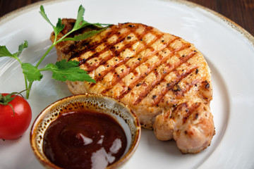 Steak on the bone with red sauce. restaurant menu