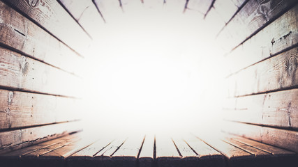 Wooden tunnel towards white light