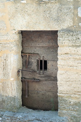 Medieval Jail door on an ancient fortress  in village Ménerbes in Provence France