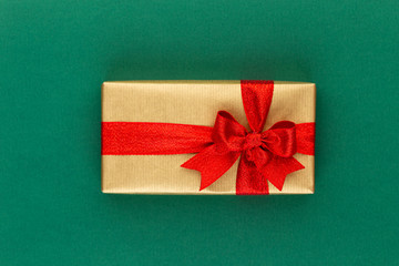 Christmas gift boxes with ribbons on color tabletop.