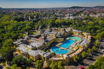 Plexiglas foto achterwand Budapest, Hungary - Aerial drone view of the famous Szechenyi Thermal Bath and Spa on a sunny summer day. Heroes' Square and Vajdahunyad Castle at background. © zgphotography