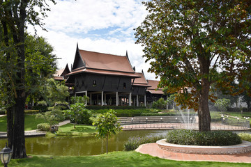Kanchanaburi, Thailand, 09.09.2019: Beautiful garden, lake, traditional Thai, Siamese clothes, buildings of 