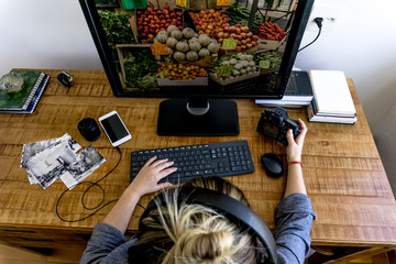 Woman in front a monitor editing photos