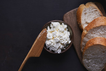 cottage cheese with wooden knife