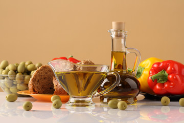 Still life with olives, olive oil, bread and pepper