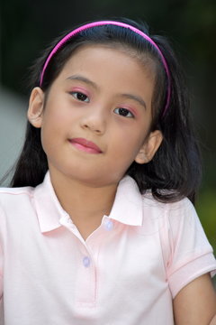 Petite Filipina Girl Child Making A Decision