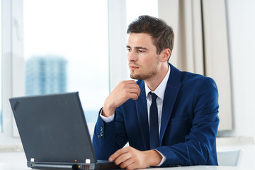 businessman working on laptop in office