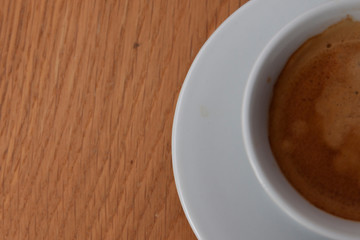 cup of coffee on wooden table