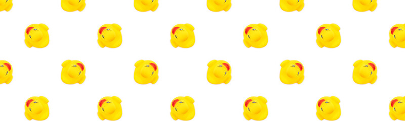 Yellow seamless pattern. Plastic toys Yellow rubber ducks.