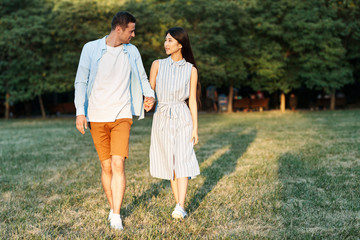 Fototapeta premium young couple walking in the park
