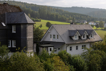 Fototapeta na wymiar Typical traditional half-timbered Vakwerk homes in the spa village of Grafschaft in the Sauerland region in Germany