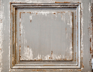 Distressed painted wood panel from a shutter or inlaid wall. Chipped paint on distressed wood surface.