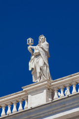 Obraz premium Detail of the statues of saints that crown the colonnades of St. Peter Square built on 1667 on the Vatican City