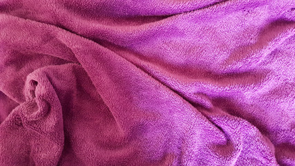 Fototapeta na wymiar Winter pink blanket with wrinkles