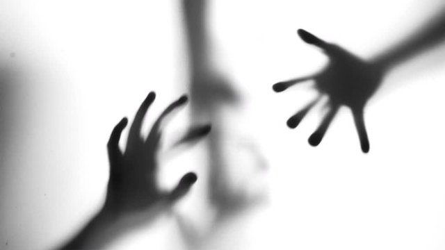 Abstract and spooky defocused hand