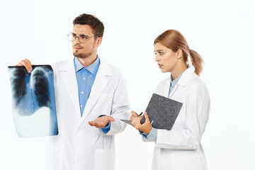 two doctors looking at an xray