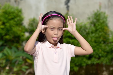 A Cute Preteen Making Funny Faces