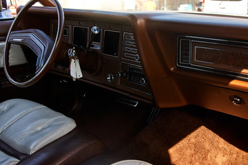 Retro car dashboard, close-up. Old automobile interior