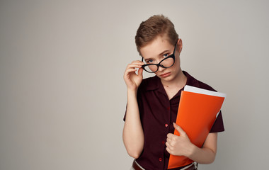 young woman with book and glasses