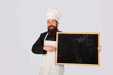 Empty menu chalkboard with copy space for text. Cooking, culinary, diet, advertisement and food concept. Chef menu. Professional chef on kitchen. Master chef, baker or cook shows menu sign blackboard.