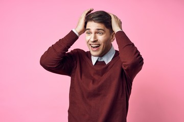 portrait of a man with hands on his head