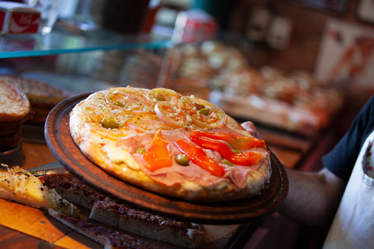 variety of pizzas, muzzarella, ham and bell pepper, onion