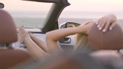 Woman Relaxing in Convertible Car - Powered by Adobe