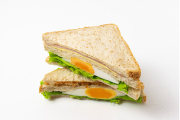 Homemade sandwich or toast wheat bread with lettuce and ham isolate on white background.