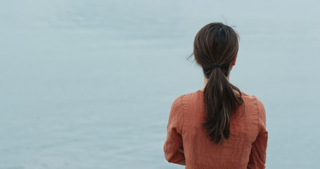 Woman look at the sea at outdoor