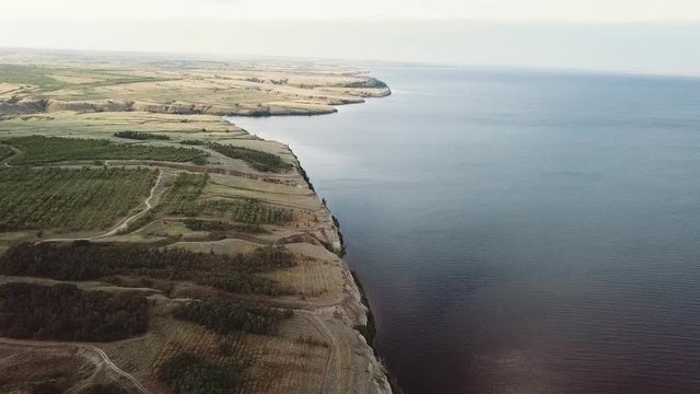 Top view on the Big lake and green fields