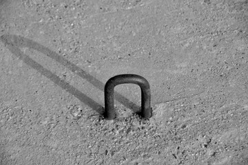 an iron loop in concrete