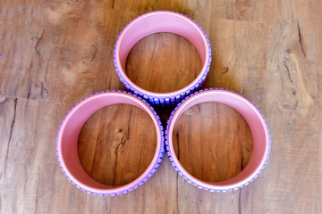 All kinds of Yoga props are on the wooden floor of the yoga studio. Conveyor belts, mats and cushion blocks are in the yoga center. The concept of health activities