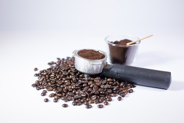 Coffee powder and Roasted coffee beans in coffee maker, Black coffee