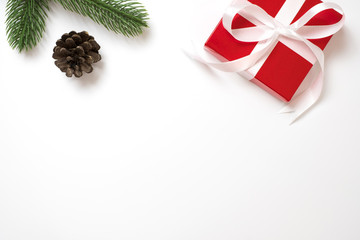 Christmas background with red gift box on white background. flat lay with copy space.