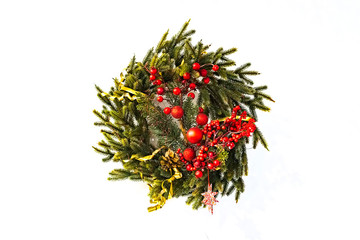 traditional green christmas wreath with holly berry isolated on white background. festive decoration, beautiful spruce wreath with red flowers, balls, berries and stars.