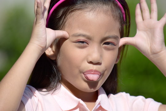 Petite Asian Juvenile Making Funny Faces