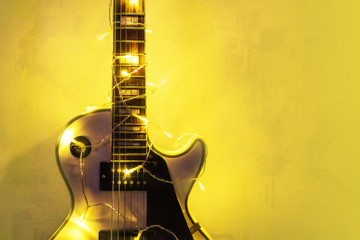 Electric guitar with lighted garland