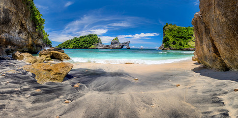Panoramic view of idyllic tropical beach with small island and perfect azure clean water