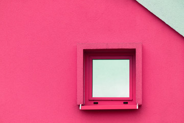 glass window on colorful pink cement exterior wall of building architecture background