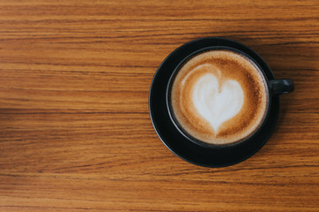Cup hot coffee wood table in cafe.